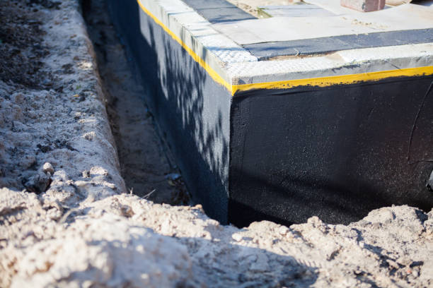 Professional Waterproofing technician working in Northville, MI